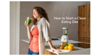 How to Start a Clean Eating Diet Fresh fruits, vegetables, whole grains, and nuts arranged on a wooden table as part of a clean eating diet.