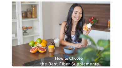 Selection of the best fiber supplements displayed on a table, featuring powders, capsules, and natural sources like fruits and grains.